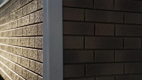Corner of brick house finished with plastic siding Video stock 168079362