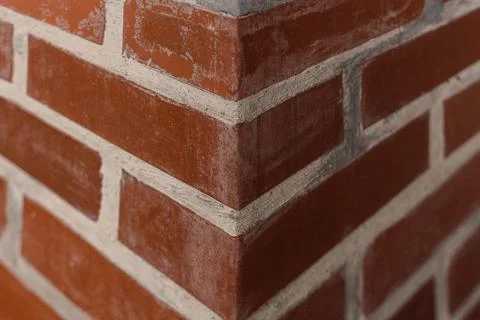 A corner of brick wall. Wall and bricks texture. Stock Photos