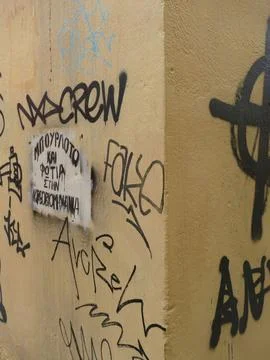 Corner of a building covered in graffiti tags including Greek writing in At.. Stock Photos