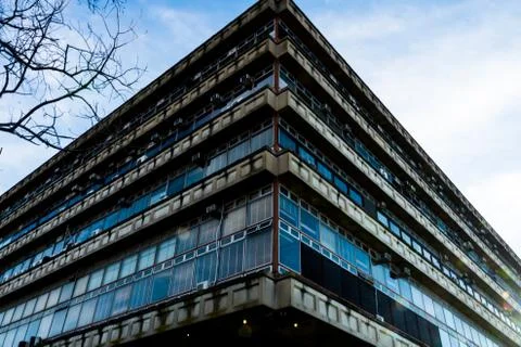 Corner of a building with lots of windows Stock Photos