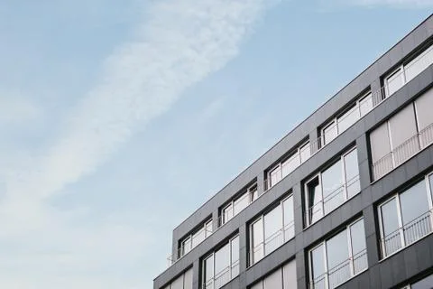 The corner of the building with many windows Stock Photos