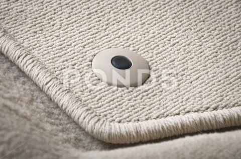 Corner of car mat with floor holder Stock Photos