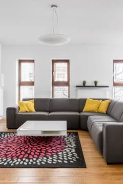 Corner couch in modern apartment Stock Photos