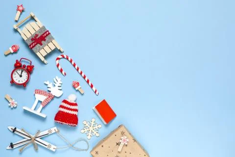 Corner creative Christmas composition. Candy cane, gift, sled, deer, hat, ala Stock Photos