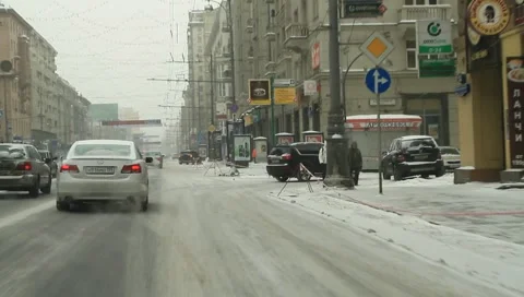 Corner Driving through downtown of city covered with white snow - HD 1920 X 1080 Stock Footage