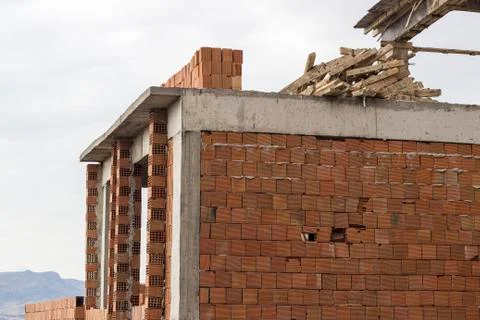 Corner facade of old incomplete building Stock Photos