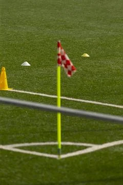 Corner flag and training cones on artificial turf soccer field Stock Photos