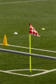 Corner flag and training cones on artificial turf soccer field Stock Photos