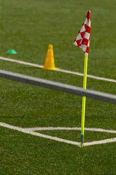 Corner flag and training cones on artificial turf Stock Photos