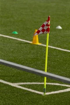 Corner flag and training cones on green artificial turf Stock Photos