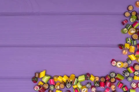 A corner frame made of colored caramel candies Foto stock