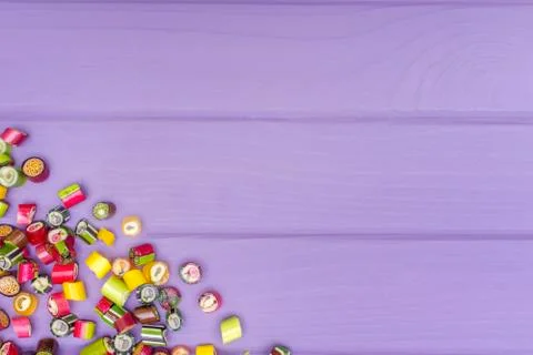 A corner frame made of colored caramel candies Stock Photos