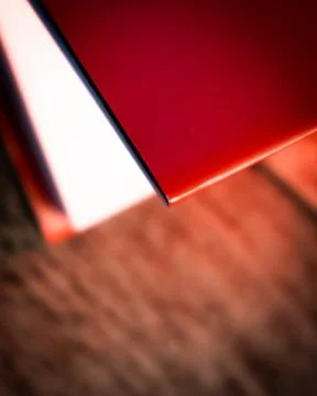 Corner of Half Open Red Book Stock Photos
