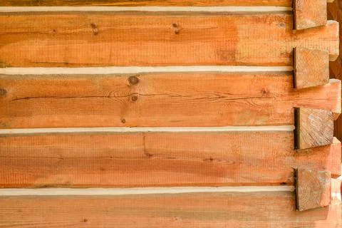 Corner of a house built with timber bars Stock Photos