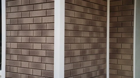 Corner of house. Wall from light Flexible facade panel imitation of clinker. Stock Footage 166174740