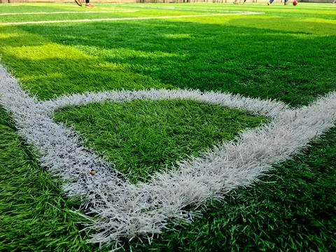 Corner kick mark on green grass field Stock Photos
