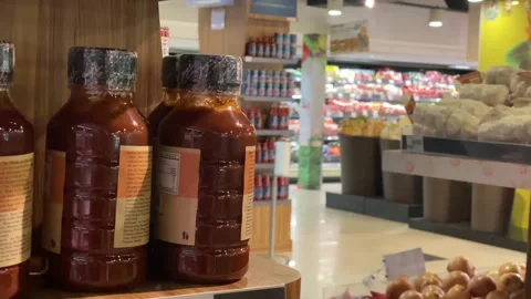 The corner of a mart and the bottle of a sauce Stock Footage 253761448