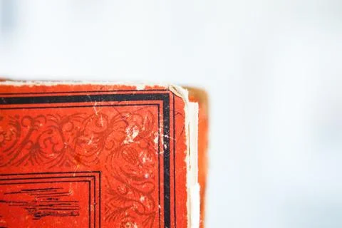 Corner of old book. Red colored ancient book Stock Photos