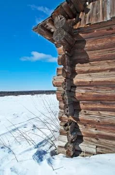 Corner of old log barn, winter time Stock Photos