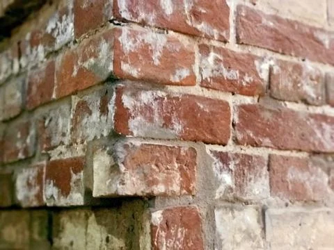 Corner of an old red and white brick wall abstract background Stock Photos