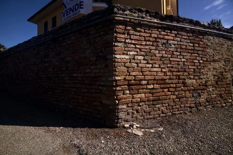 Corner of a path made by a brick wall Stock Photos
