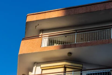 A corner perspective shoot to an old building with orange walls Stock Photos