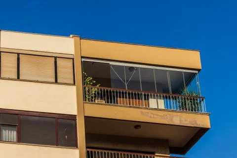 A corner perspective shoot to an old building with yellow walls Stock Photos