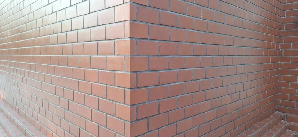 Corner perspective view of orange  brick wall Foto stock