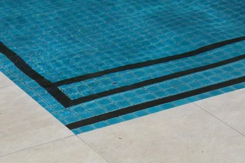 Corner of a pool with water Stock Photos
