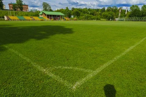 Corner of a soccer field with empty stands Stock Photos