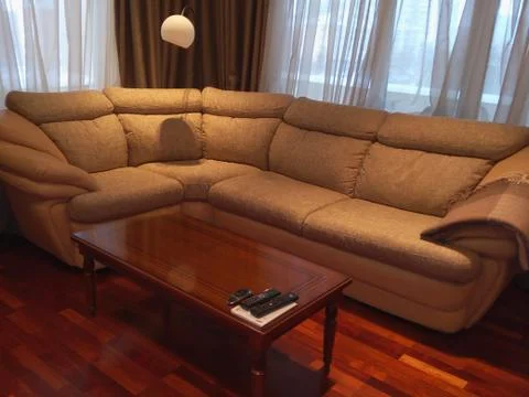 Corner sofa and coffee table  Stock Photos