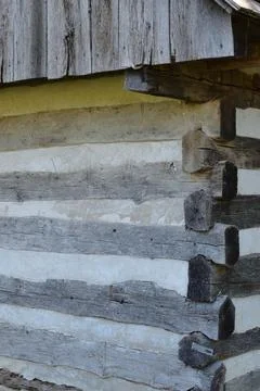 Corner of split log cabin Stock Photos