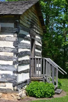 Corner of split log home Stock Photos