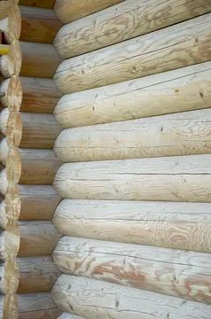 A corner of a timber frame made from logs with distinct texture Stock Photos