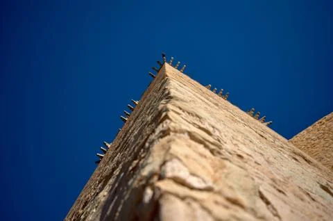 Corner of the tower of a castle Stock Photos