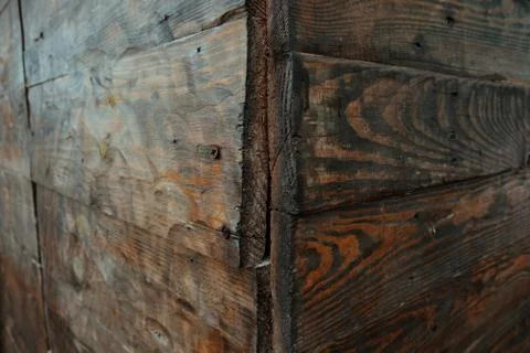 Corner view of a rotten wall made from wood, wooden texture background Stock Photos