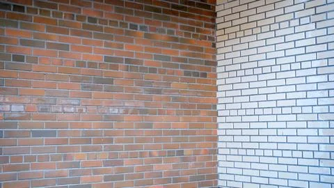 Corner wall joining two different brick textures brown and white creating d.. Stock Photos
