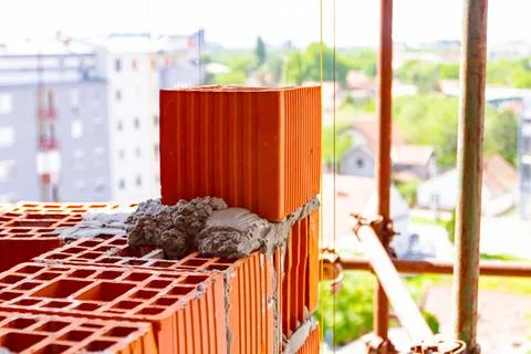 Corner of wall made of red brickwork Stock Photos
