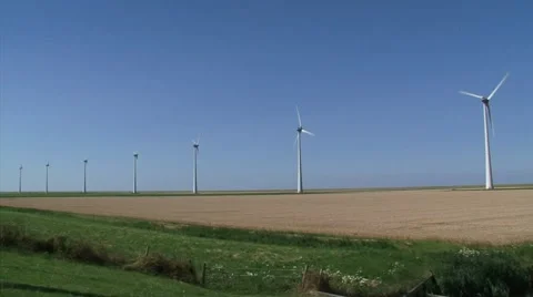 Cornfield and wind turbines in Dutch sea clay landscape + pan trackway Stock Footage 40589728