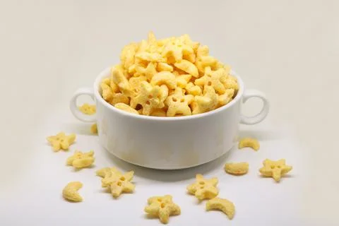 Cornflake cereals in a white bowl. Easy breakfast for kids. Quick breakfast. Stock Photos