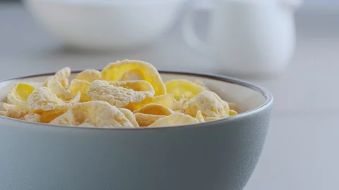 Cornflakes in a blue ceramic bowl Stock Footage 121645241