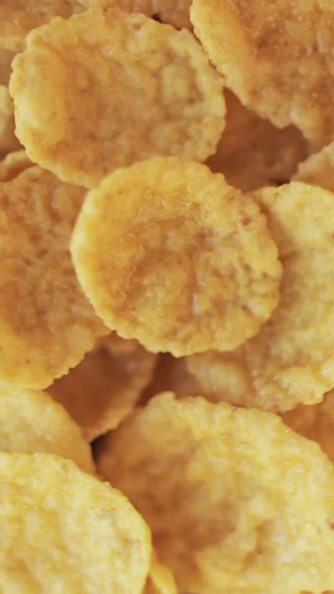Cornflakes close-up rotating background. Macro shot. Vertical video. Stock Footage 271479920