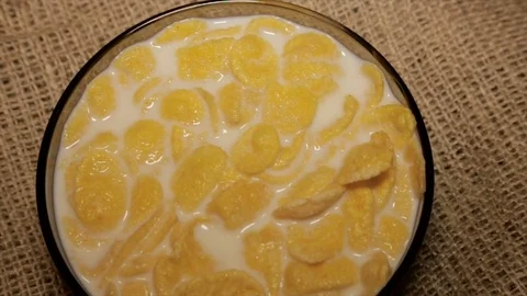 Cornflakes drenched fresh milk. Full hd video Stock Footage 72189765