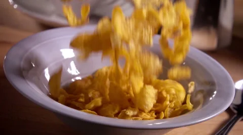 Cornflakes fall into bowl in slow motion Stock Footage 58033515
