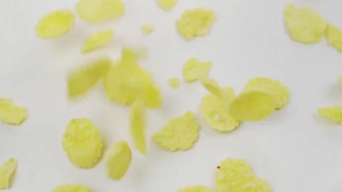 Cornflakes Falling On White Surface, Close-up. Falling Corn Flakes. Ready Health Stock Footage 165270391