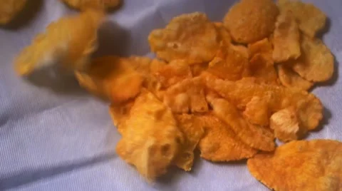 Cornflakes jumping up and down on white material 動画素材 46023533