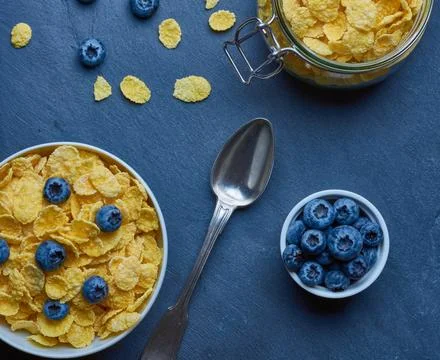 Cornflakes with milk for breakfast. Stock Photos