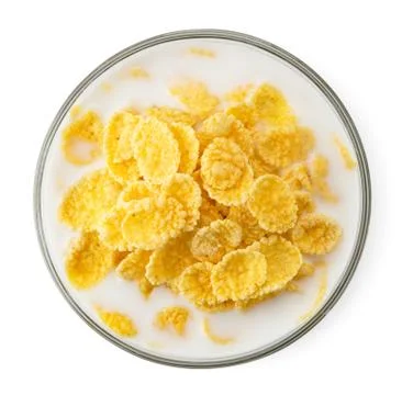 Cornflakes with milk in a plate on a white. The form of the top Stock Photos