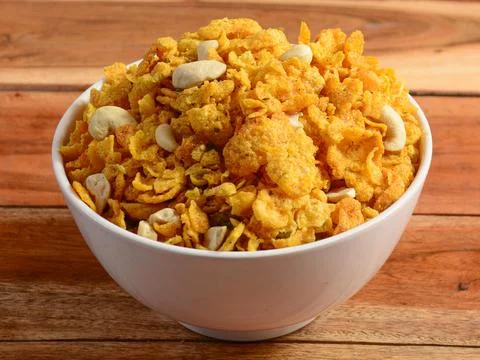 Cornflakes mixture or cornflakes Chivda loaded with peanuts and Cashews. serv Stock Photos