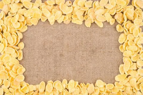 Cornflakes on sackcloth. Stock Photos